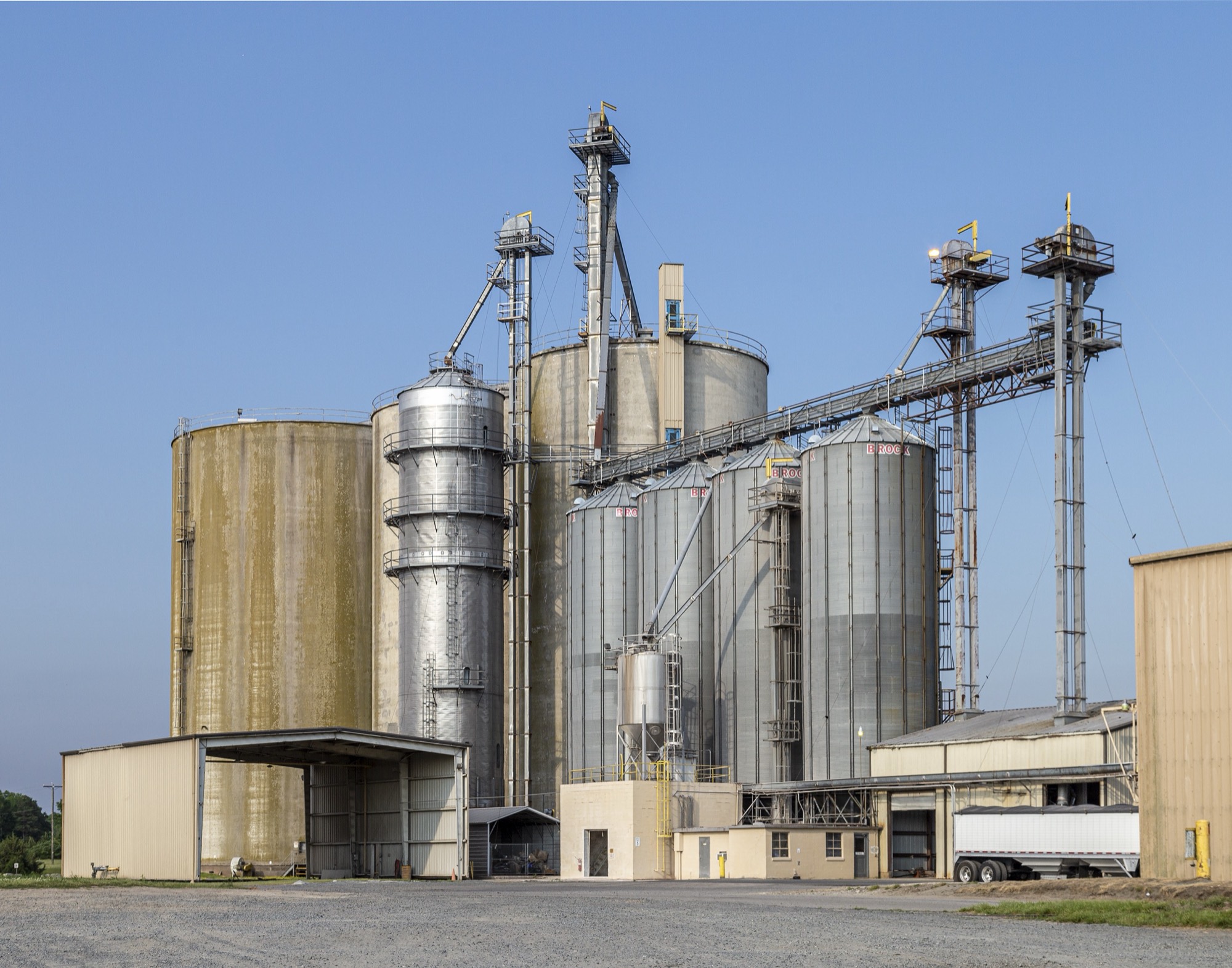 The grain elevator at Snow Hill, Maryland, its silos and conveyors against a clear sky