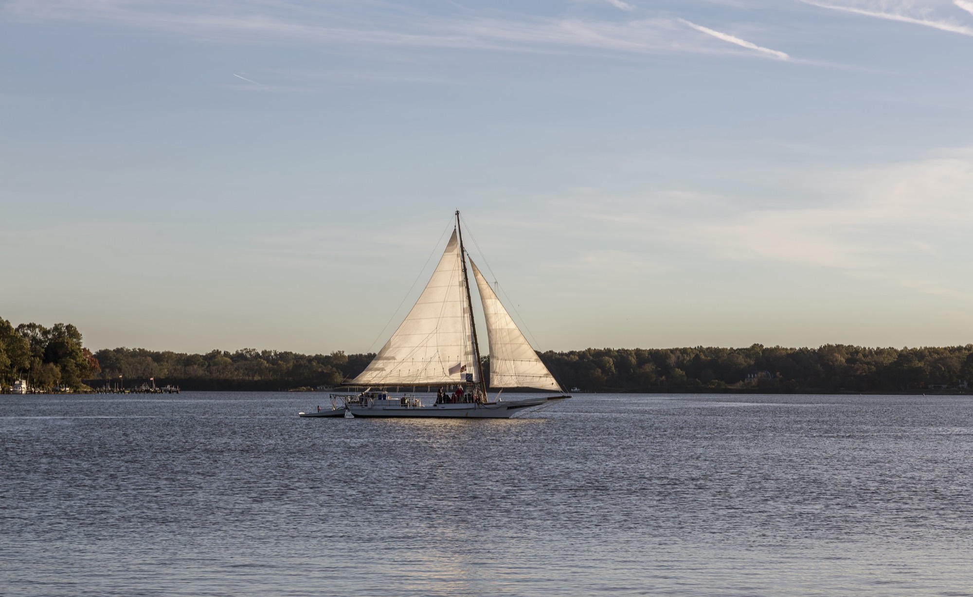 The skipjack Elsworth under sail on the Chester River near Chestertown, in evening light