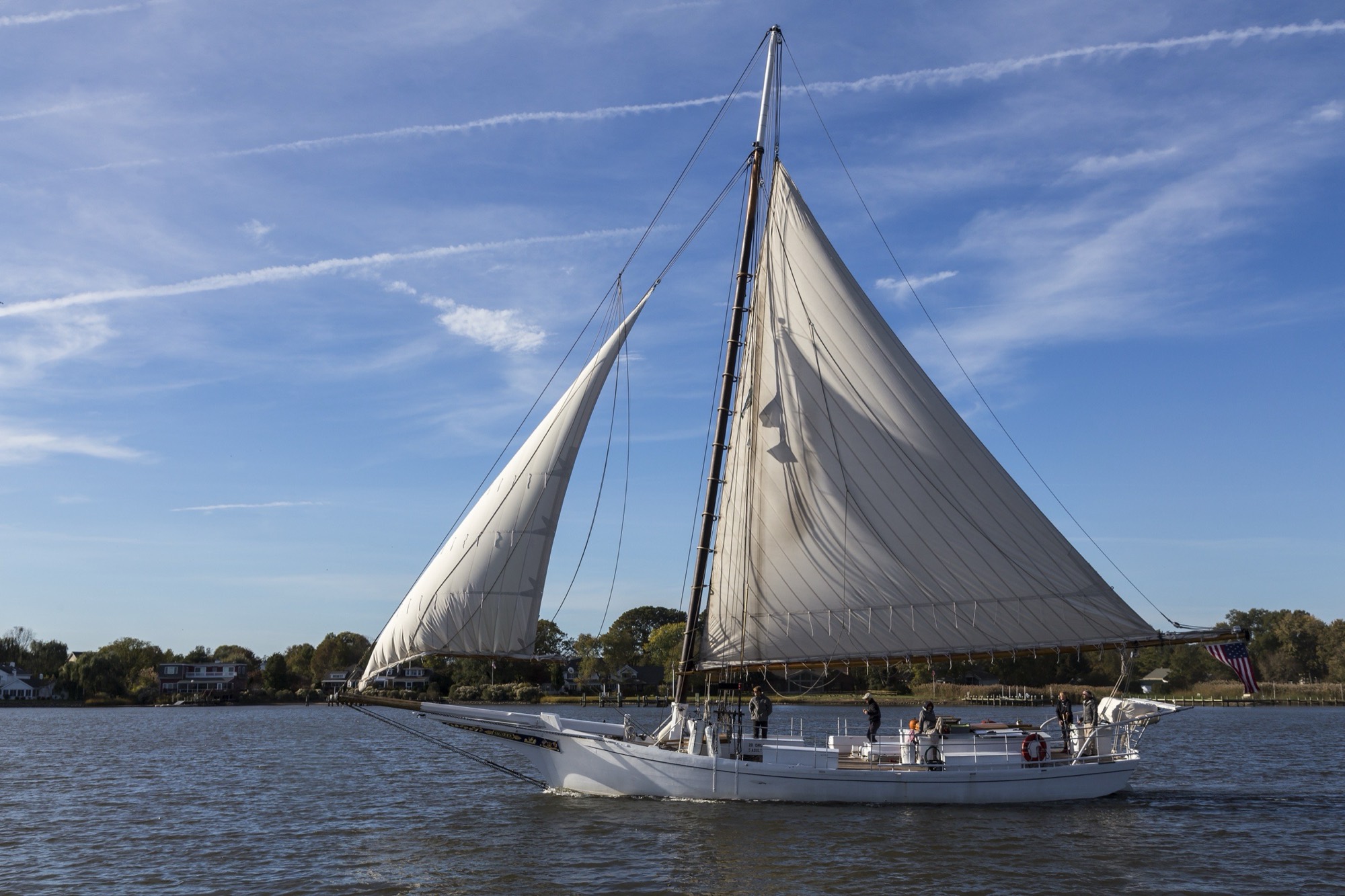 The skipjack Sigsbee under full sail on the Chester River at Chestertown, Maryland
