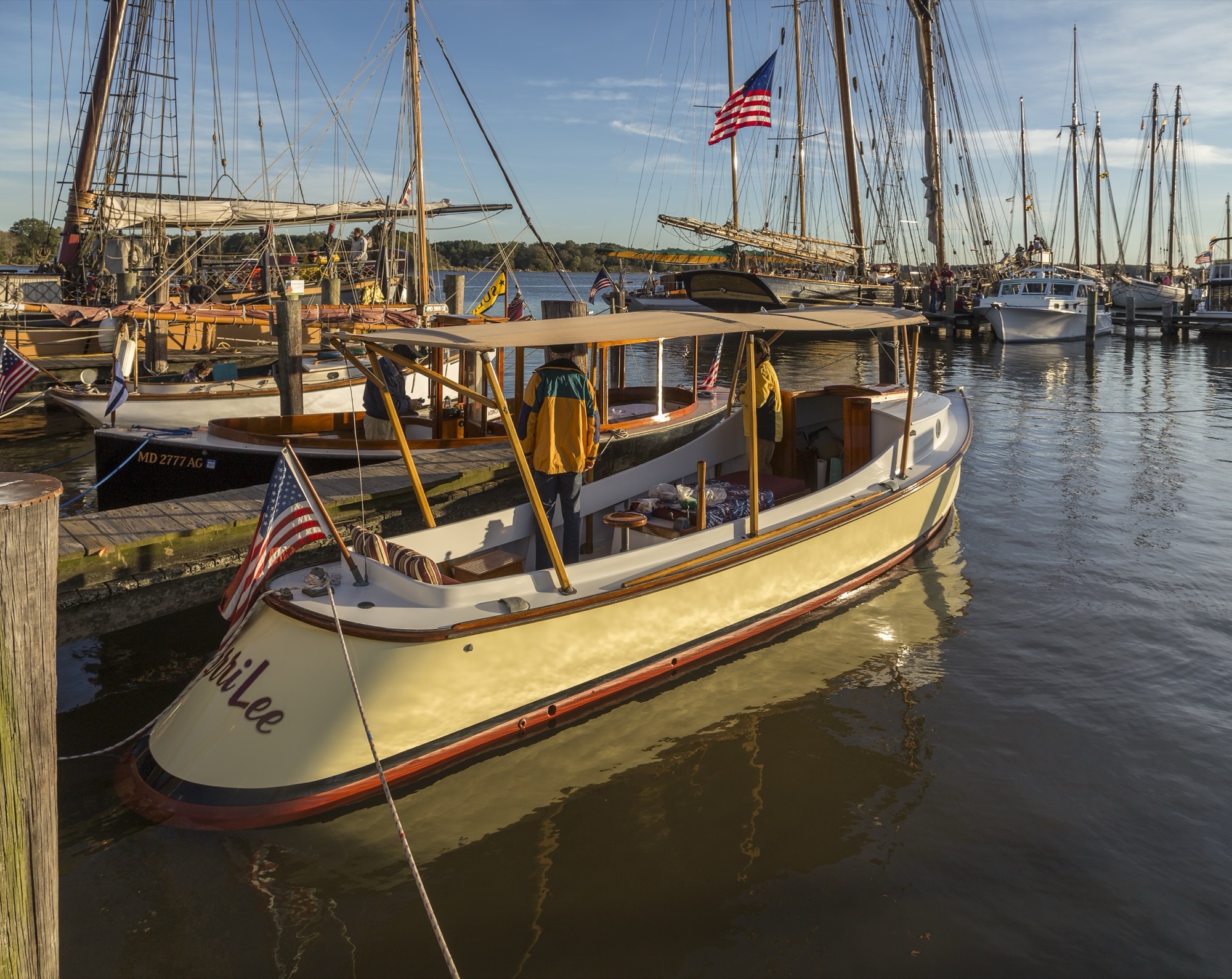 The draketail skiff Perri Lee among the masts at Chestertown, Maryland, in the evening