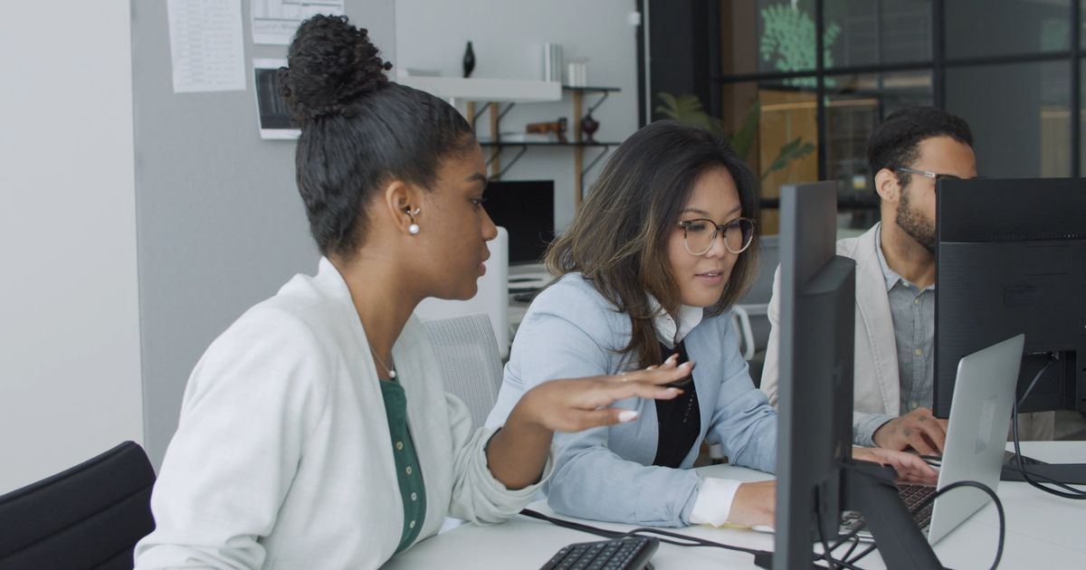 A team at work on the systems behind a local business.